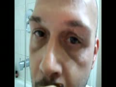 Bald scat gay putting shit in his mouth